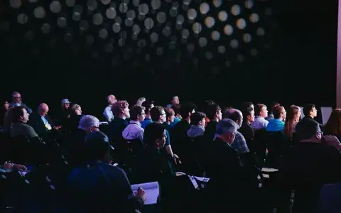 Audience seated at a conference