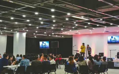 Audience watching a presentation in a large hall