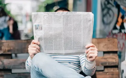 A man reading a newspaper