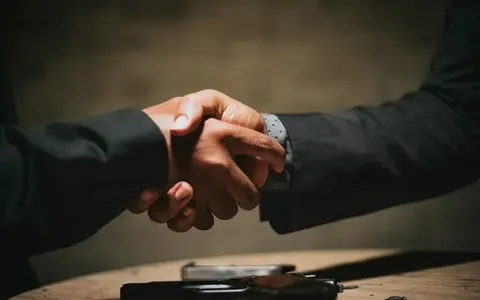 Two people shaking hands